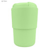 A light green reusable coffee cup with a ribbed silicone sleeve and a secure lid, featuring a logo.