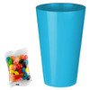 A blue party cup next to a pack of multicoloured jelly beans in assorted shades.