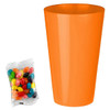 An orange party cup beside a clear packet of assorted jelly beans in various vibrant colours.