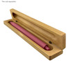 A wooden presenter box in light timber colour with a pink pen inside, featuring a logo on the box.