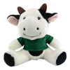 A plush cow toy featuring black and white fur with a green shirt, smiling with ear and horn details.