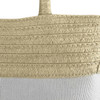 A patterned tote bag in light beige and white, featuring woven textures and a branded logo.