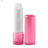 A pink lip balm stick with a white balm inside, accompanied by a matching pink cap. The product has a logo.