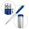 A metal pen with a blue barrel and silver accents, featuring a textured grip and a clip. It has a logo.