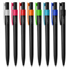 A collection of black pens with various coloured clips: pink, orange, green, blue, and white. Each pen has a branding logo.