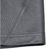 A close-up of the hem and fabric of a grey men's sustainable polo shirt, featuring a stitched edge.