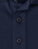 A navy blue polo shirt featuring a button placket and a logo. The fabric is a sustainable poly/cotton blend.