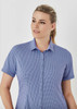 A button-up women's shirt in a blue checkered pattern with short sleeves and a collared neckline.