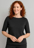 A black short sleeve T-shirt featuring a round neckline, worn by a woman with curly red hair.