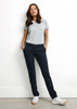 A pair of women's navy chino pants with pockets, paired with a grey t-shirt and white sneakers.