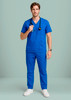 A man wearing a blue V-neck scrub top and matching trousers, holding a stethoscope, with a logo visible.