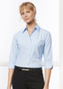 A light blue women's micro check 3/4 sleeve button-up shirt with a collar, worn with black trousers.
