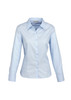 A light blue women's long sleeve button-up shirt with a collar and a logo on the label.