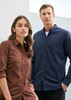 A brown long sleeve button-up shirt and a navy long sleeve button-up shirt on models, featuring a logo on one shirt.