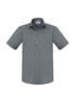 A grey short sleeve button-up shirt with a pocket and a logo on the label.