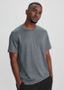 A grey short sleeve tee featuring a logo, designed for men with a relaxed fit.