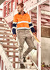 Men's essential basic stretch cargo pants in beige, featured with a logo, paired with an orange and navy work shirt.
