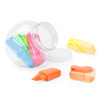 A jar containing brightly coloured highlighters: green, blue, orange, yellow, and pink. The jar has a clear design.