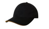 A black cap featuring a sandwich trim in orange, with a curved visor and an adjustable strap at the back.