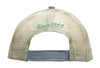A cap with a mesh back in light beige, featuring green stitching and a logo on the back.
