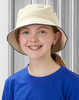 A child wearing a soft washed cream bucket hat with a contrasting trim, set against a grey background.