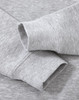 A grey crew fleece sweater featuring long sleeve cuffs and a soft texture, with a logo present.