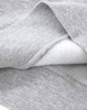 A close-up of a grey crew fleece sweatshirt showing the soft interior fabric and detailed stitching.