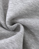 A close-up of soft, grey fabric with a slight texture, typical of a fleece jumper. It features a logo.