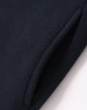 A close-up of a navy fleecy jumper featuring a half-zip collar and pockets. The fabric appears soft and textured.