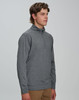 A grey men's half zip long sleeve sweat top, featuring a stand-up collar and long sleeves. There is a logo on the garment.