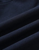 A navy blue softshell fabric displaying smooth, folded sections, featuring a logo. Suitable for a full zip hoodie.