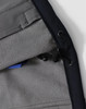 A close-up of the interior lining of a navy men's softshell full zip hoodie, featuring a drawstring and a pocket.