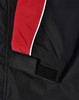 A unisex jacket featuring black fabric with red and white accents and a velcro closure on the sleeve.