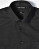 A black pin dot short-sleeve button-up shirt featuring a collar, buttons, and a pocket, with a logo on the label.