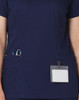 A navy scrub top featuring contrast colour detailing, with pockets for tools and a name badge holder.