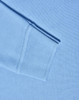 A light blue long sleeve polo shirt made from poly/cotton pique knit, featuring ribbed cuffs.