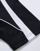 A close-up of a black polo shirt with white stripes, featuring a logo on the fabric.