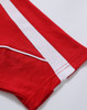 A red polo shirt featuring white stripes and a logo, showcasing its sporty design and breathable fabric.