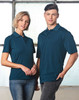A teal men's polo shirt with a classic collar and a logo, displayed on a male model.