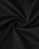 A close-up of black fabric, featuring a smooth texture with a slight stretch, typical of a polo shirt.
