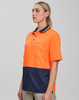 A short-sleeve polo shirt in high-visibility orange with a navy blue bottom, featuring a pocket and branding.