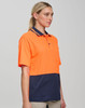 A safety polo shirt featuring high-visibility orange and navy blue colours, with a collar and a pocket.