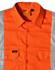 An orange work shirt featuring reflective silver strips and a logo on the front pocket.