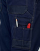 Light weight semi-fitted Cordura work pants in navy, featuring pockets with a pencil and marker visible. Includes a logo.