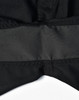 A close-up of black rip-stop poly/cotton stretch work shorts featuring a waistband detail. The shorts have a logo.