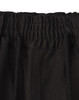 A close-up of the waistband of black unisex cotton stretch drill work shorts, featuring an elastic band and drawstring.