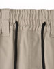 A pair of beige unisex cotton stretch drill work shorts featuring an elastic waistband and black drawstring.