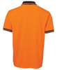 An orange polo shirt featuring a navy collar and striped cuffs, with a logo on the side.