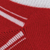 A close-up of a red ankle sock featuring white stripes and a textured knit pattern. The sock has a logo.