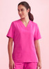 A pink women's V-neck scrub top with short sleeves and two front pockets. It features a logo on one sleeve.